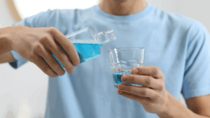 Man getting a mouthwash