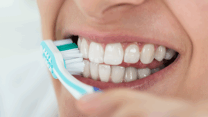 Woman brushing teeth