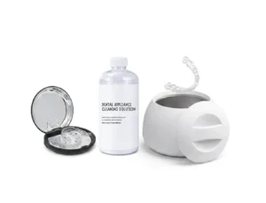 Ultrasonic cleaner, solution, and case set up for how to clean Invisalign retainers.